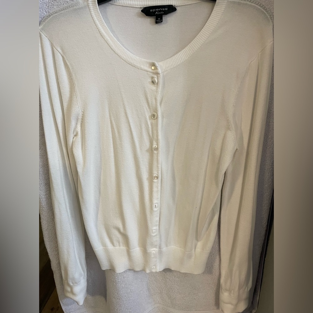 Sweater.  White. Business casual.